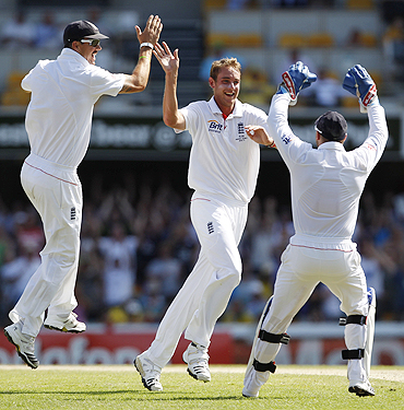 England's Stuart Broad (centre) celebrates with teammates after dismissing Australia's Simon Katich on Monday