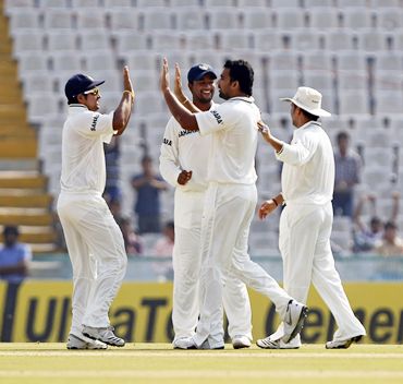 Zaheer Khan (second from right) celebrates with teammates after dismissing Simon Katich leg before wicket