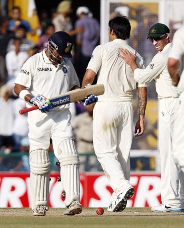 Mitchell Johnson (centre) celebrates with teammates after dismissing India's Gautam Gambhir