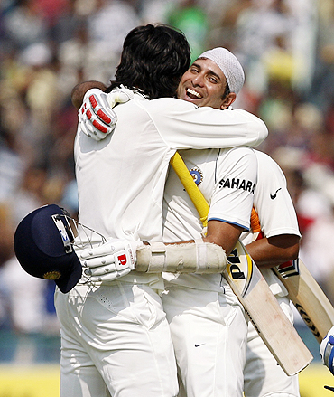 VVS Laxman and Ishant Sharma embrace after the victory