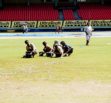 Groundsmen at work in Kochi ahead of the first one-dayer