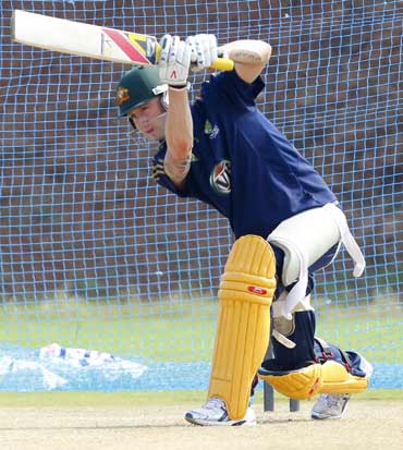 Australia's Tim Paine throws a ball at a cricket practice session in Vishakhapatnam