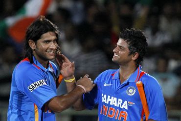 Saurabh Tiwary (L) and Suresh Raina at the end of the second ODI