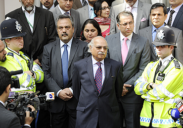Pakistan's High Commissioner to Britain, Wajid Shamsul Hasan, speaks to the media outside the Pakistan high commission in London on Wednesday