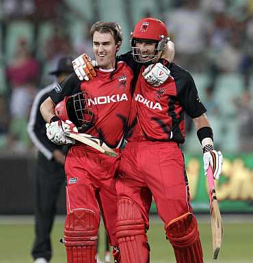 South Australian Redbacks' Borgas (left) and Cooper celebrate winning their match against Mumbai Indians in Durban