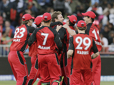 South Australian Redback's players celebrate the wicket of Robin Uthappa
