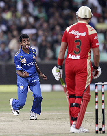 Mumbai Indians' Abu Nechim (left) reacts after claiming the wicket of Royal Challengers Bangalore's Jacques Kallis