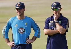 Ponting and batting coach Justin Langer watch Australia's net session on Friday