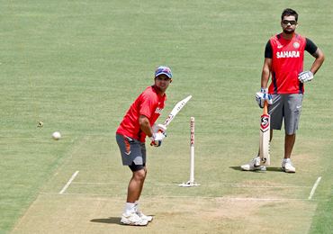Suresh Raina and Virat Kohli practice at the Wankhede Stadium on Friday