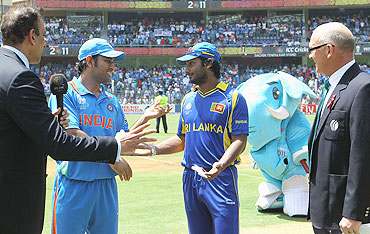 Dhoni (2nd from left) and Sangakkara (centre) agree a re-toss of the coin