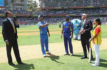 MS Dhoni spins the coin during the World Cup final against Sri Lanka