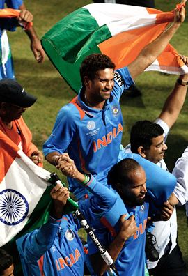 Tendulkar is chaired by teammates after the triumph