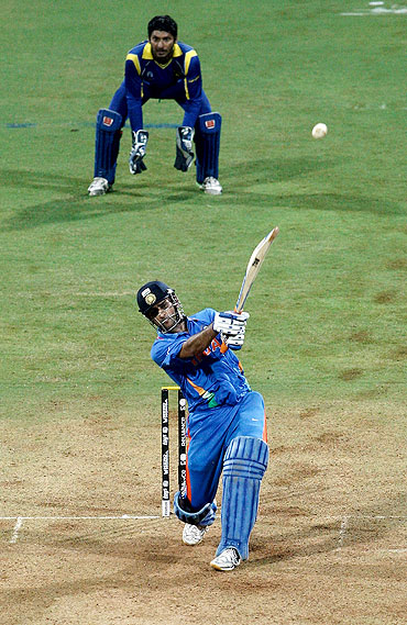 Indian cricket captain Mahendra Singh Dhoni hitting the winning six in the World Cup final.