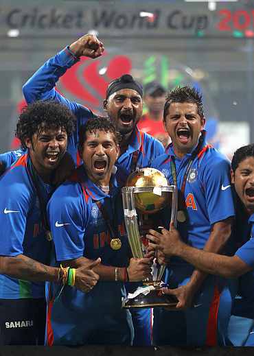 Indian team members celebrate after winning the World Cup.