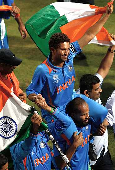 Sachin Tendulkar is chaired by his teammates on a lap of honour after the World Cup triumph