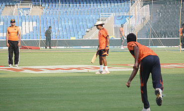 Pune Warriors' assistant coach Praveen Amre (centre) with the players at the training session
