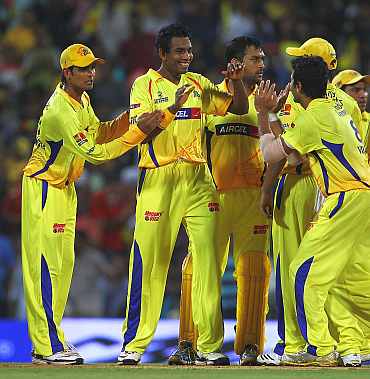 Chennai Super Kings team celebrate after picking up a wicket