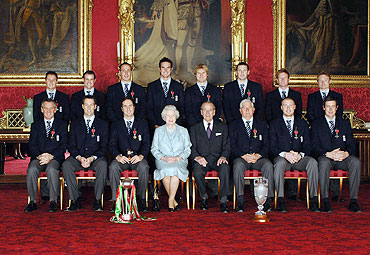 Members of England's 2005 Ashes winning Cricket team and coach Duncan Fletcher (3rd from right) Queen Elizabeth II (4th from L) and the Duke of Edinburgh (4th from R) in Buckingham Palace in London at an investiture ceremony