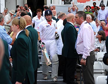 Ian Bell makes his way out of the dressing room after the tea break, following his reinstatement after being given run out