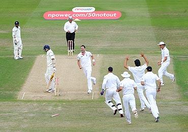 England players celebrate after the dismissal of VVS Laxman on Monday