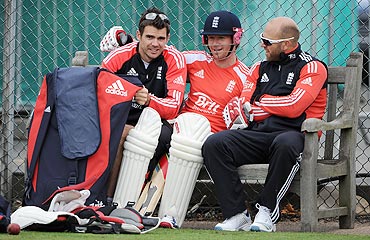 James Anderson, Eoin Morgan and Matt Prior take a break during a nets session