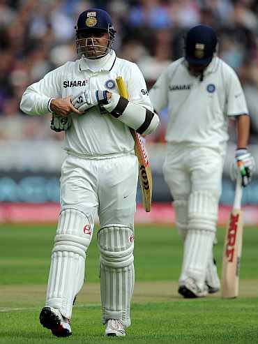 Virender Sehwag walks back to the pavillion after being dismissed