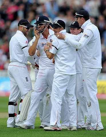 England's players celebrate an Indian dismissal