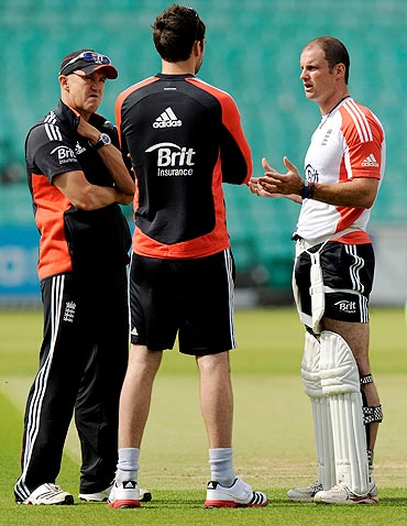 England's coach Andy Flower (left) and captain Andrew Strauss (right) speak with James Anderson during a nets session