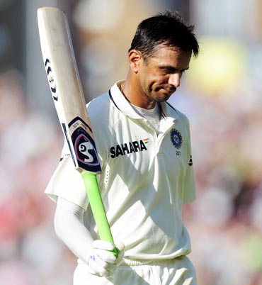 Rahul Dravid walks back after being dismissed by Graeme Swann in India's second innings