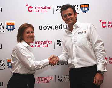 Former Australian cricketer Adam Gilchrist with Professor Judy Raper, Deputy Vice Chancellor (research) UOW