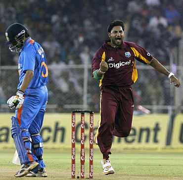 Ravi Rampaul celebrates after picking up the wicket of Gautam Gambhir