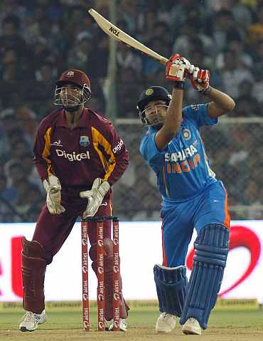 Rohit Sharma hits a six during his knock against West Indies
