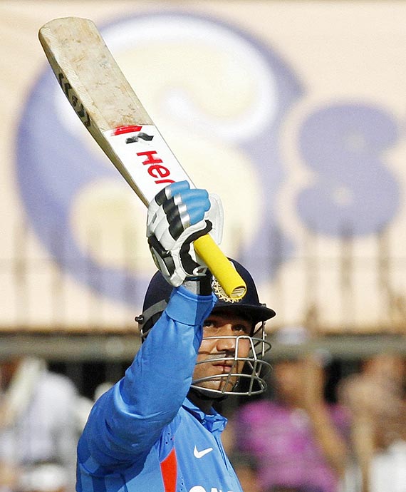 Sehwag brought up his half century with a huge six