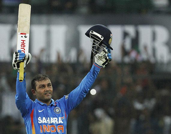 Virender Sehwag celebrates on completing his double century against West Indies on Thursday