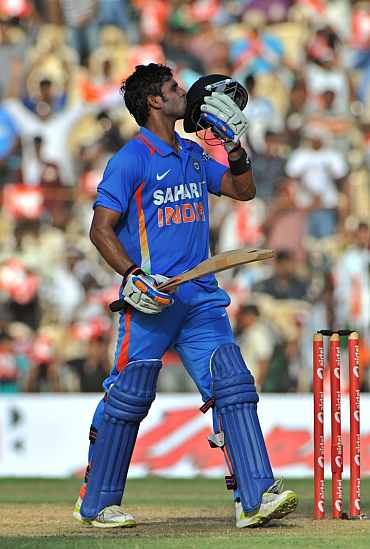 Manoj Tiwary reacts after reaching his century