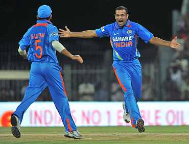 Irfan Pathan celebrates after picking the wicket of Lendl Simmons