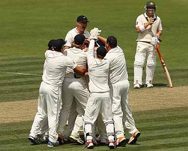 New Zealand players celebrate after winning the