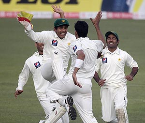 Pakistan players celebrate after dismissing Shahriar Nafees on Sunday