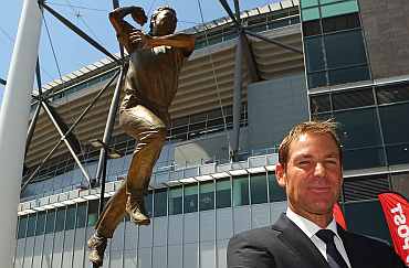 Shane Warne poses during the unveiling of the Shane Warne statue at the Melbourne Cricket Ground