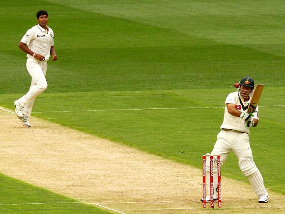 Ricky Ponting is struck on the helmet attempting a hook shot off the bowling of Umesh Yadav