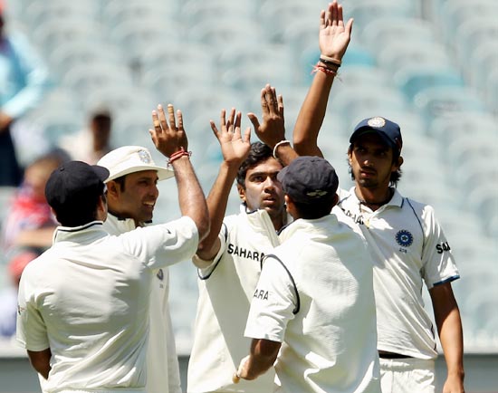 R Ashwin celebrates with his team-mates after taking the wicket of Ben Hilfenhaus