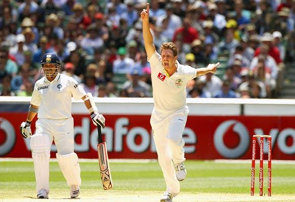 James Pattinson celebrates the wicket of Rahul Dravid as Sachin Tendulkar looks on in the 1st Test at the MCG on December 29, 2011