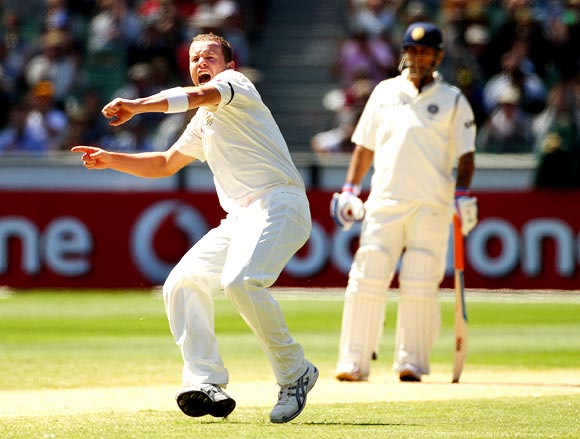 Peter Siddle is jubilant after getting the wicket of R Ashwin as Mahendra Singh Dhoni looks on