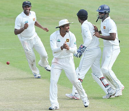 Tillakaratne Dilshan of Sri Lanka celebrates woth team-mates