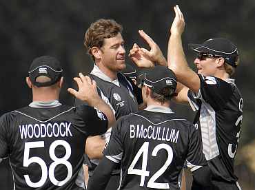 New Zealand players celebrate after dismissing an Indian player