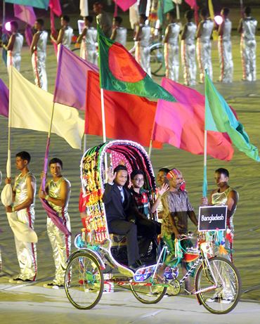Bangladesh's captain Shakib Al Hasan arrives on a rickshaw at opening ceremony