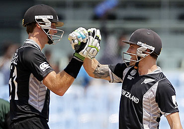 New Zealand's Brendon McCullum (right) and Martin Guptill celebrate their victory over Kenya in Chennai on Sunday