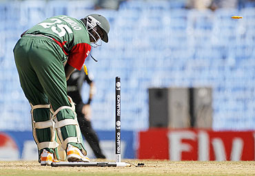 Kenya's Steve Tikolo looks back as he is bowled by New Zealand's Hamish Bennett in Chennai on Sunday