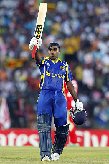 Mahela Jayawardene acknowledges the crowd after completing his century against Canada on Sunday