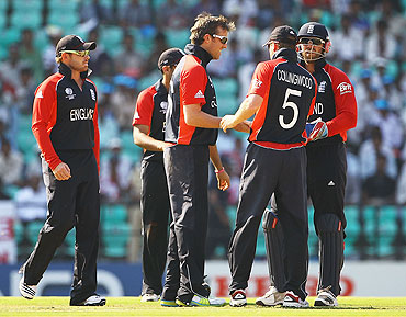 England's Graeme Swann is congratulated by teamamates after claiming the wicket of Wesley Barresi